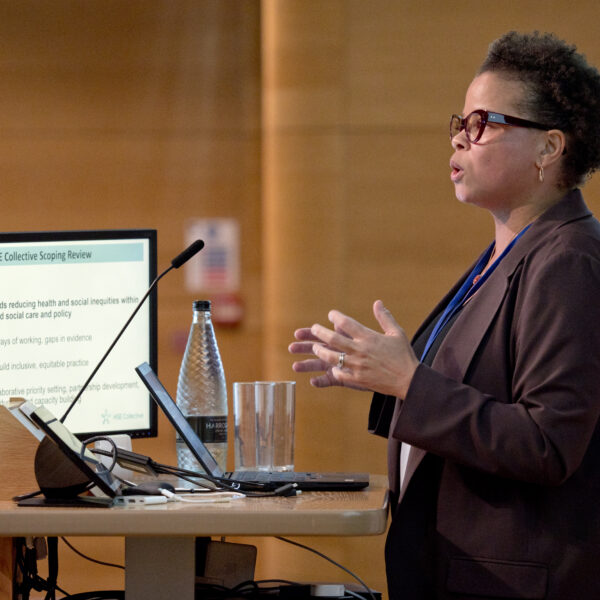 Professor Stephani Hatch, a Black woman with short hair and glasses, speaking at the EDIS Symposium